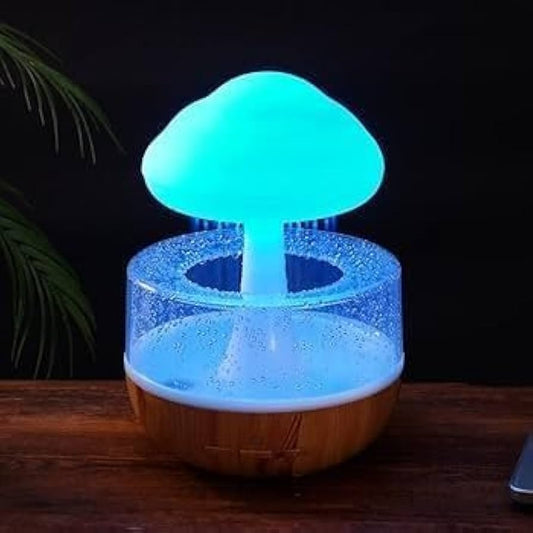 Souqzila cloud rain humidifier with glowing blue mushroom design and wooden base on table