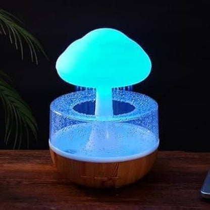 Souqzila cloud rain humidifier with glowing blue mushroom design and wooden base on table